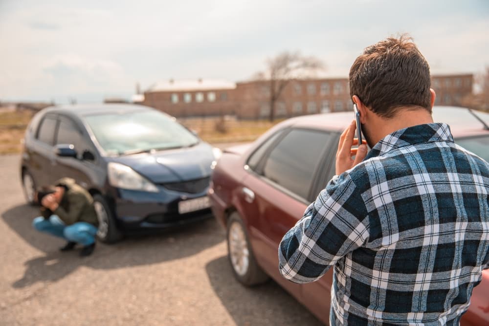 Driver calling for help after a car accident.