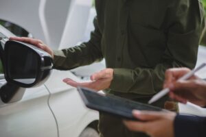 lawyer calculating car accident damages on a tablet