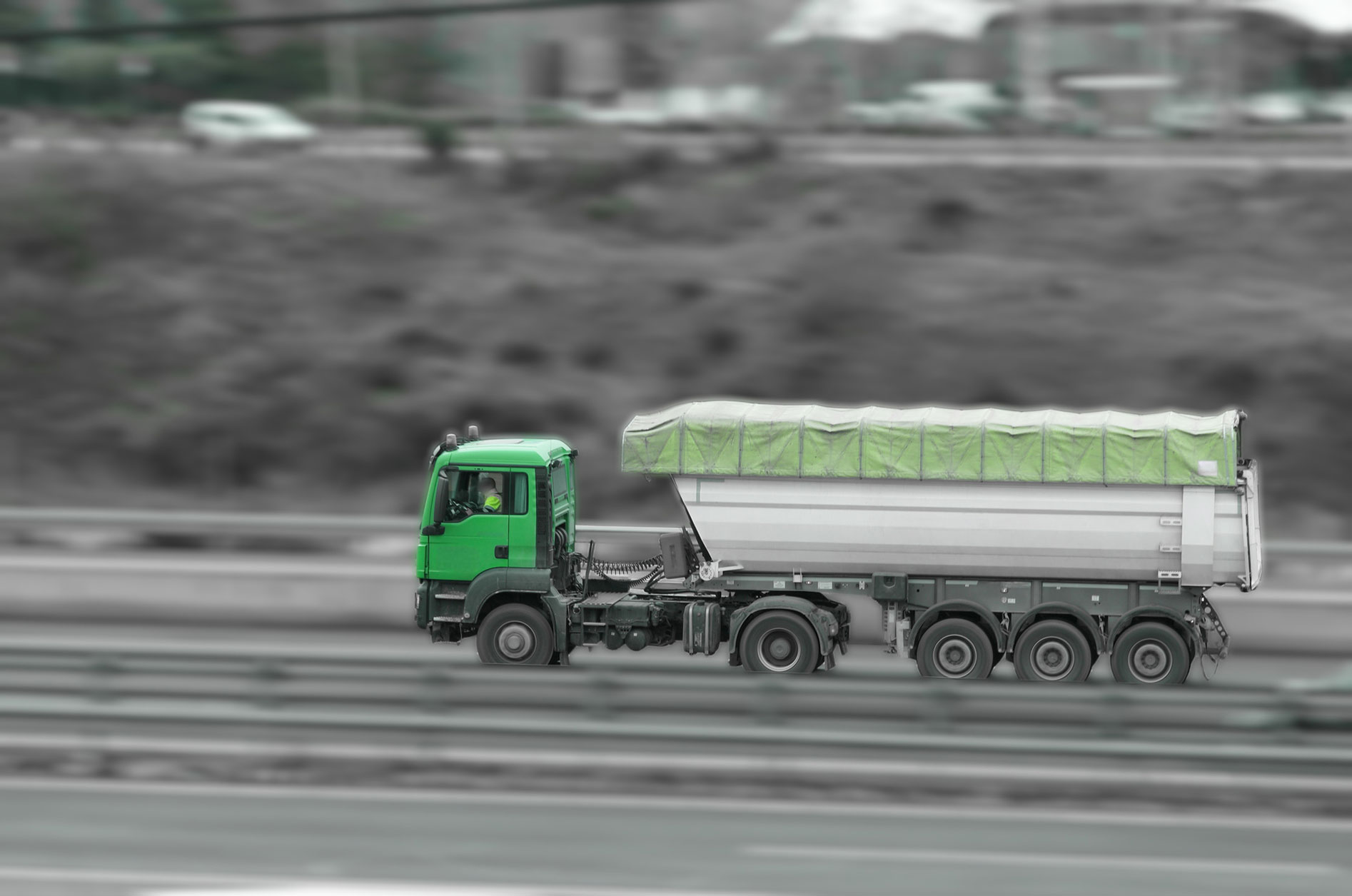 Car and commercial truck on a highway concept image, representing falling cargo accidents and truck crash liability in Pennsylvania