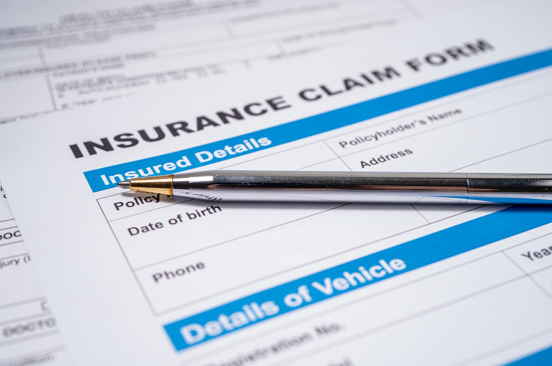 Insurance claim form and pen concept image, representing documenting economic damages and Full Tort vs Limited Tort claims in Pennsylvania