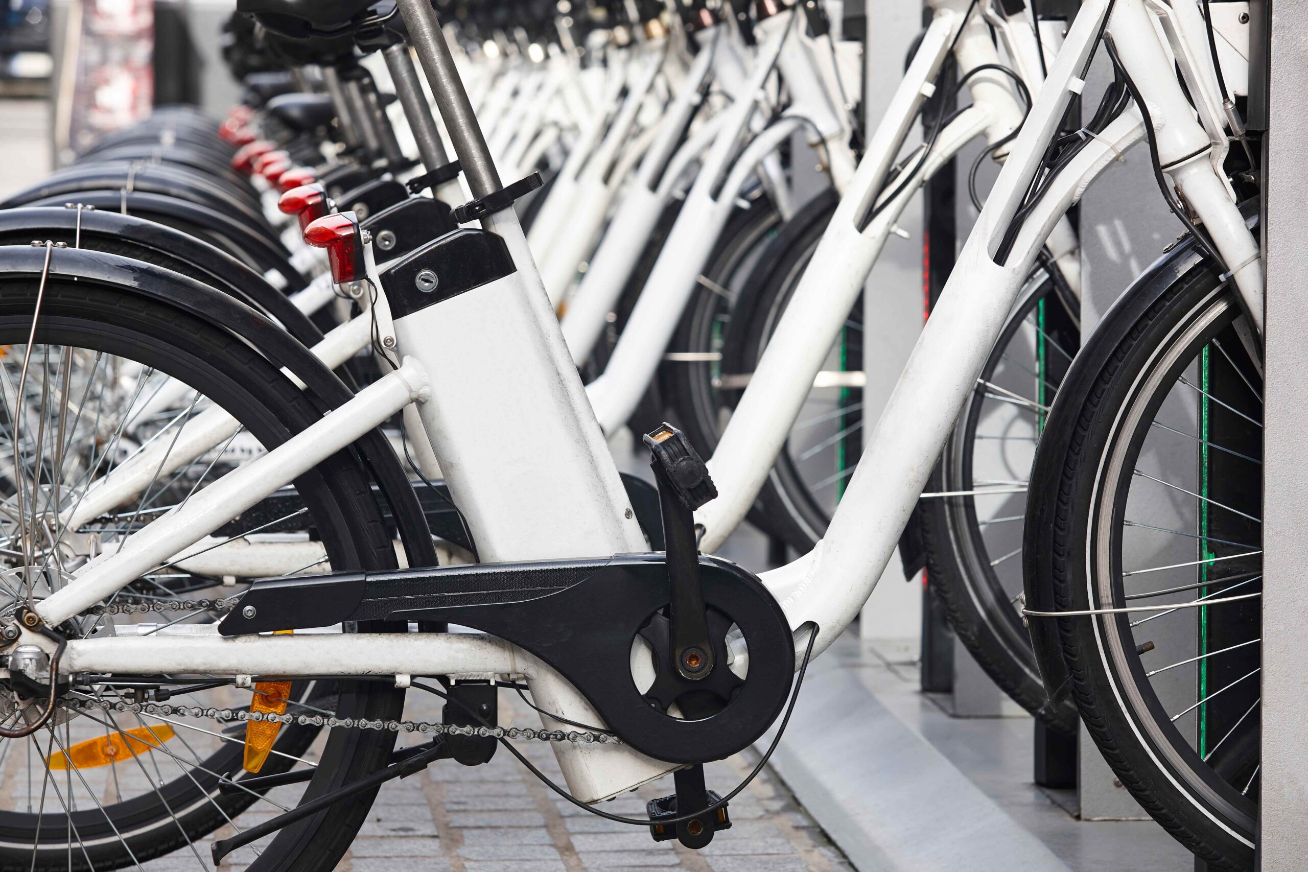 Electric bikes parked in a row, showing battery packs and frames — Pennsylvania eBike accident lawyer